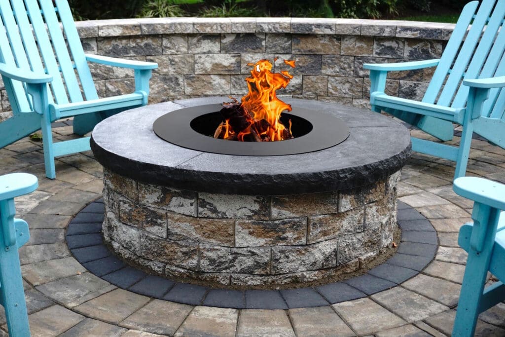 outdoor fire pit with sitting wall and chairs